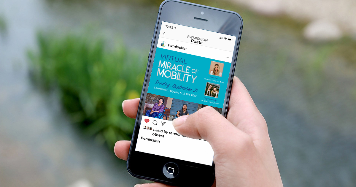 A thumb scrolling on a phone, viewing a post about Miracle of Mobility events.
