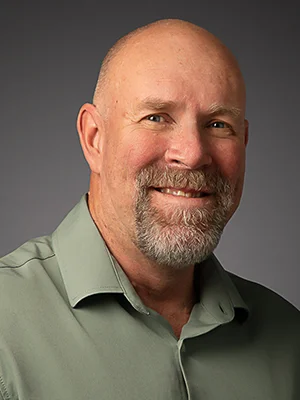 Headshot of Wayne Twigg, smiling